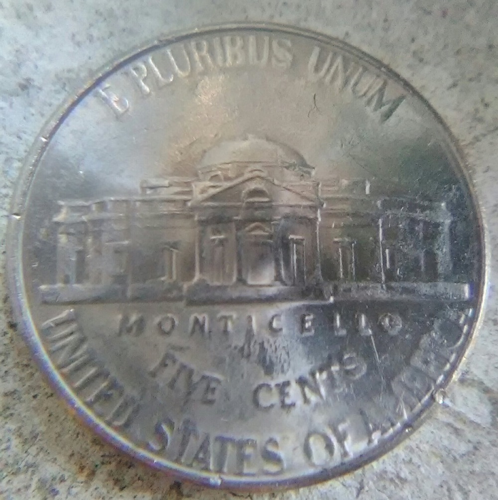 2018 nickel grease struck-through error showing areas of missing or weak design detail on obverse