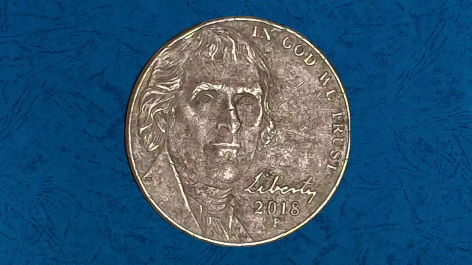 2018 nickel missing clad layer error showing copper core exposed on one side contrasting with normal nickel surface